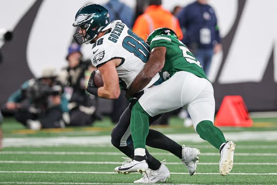 Philadelphia Eagles tight end Dallas Goedert (88) fights for yards as New York Jets linebacker Quincy Williams (56) tackles during the second half at MetLife Stadium.