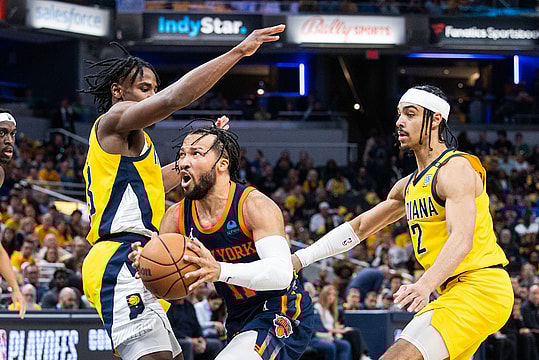 May 12, 2024; Indianapolis, Indiana, USA; New York Knicks guard Jalen Brunson (11) shoots the ball while  Indiana Pacers forward Aaron Nesmith (23) defends during game four of the second round for the 2024 NBA playoffs at Gainbridge Fieldhouse. Mandatory Credit: Trevor Ruszkowski-USA TODAY Sports