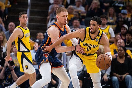 May 12, 2024; Indianapolis, Indiana, USA;  Indiana Pacers guard Tyrese Haliburton (0) dribbles the ball while New York Knicks guard Donte DiVincenzo (0) defends during game four of the second round for the 2024 NBA playoffs at Gainbridge Fieldhouse. Mandatory Credit: Trevor Ruszkowski-USA TODAY Sports