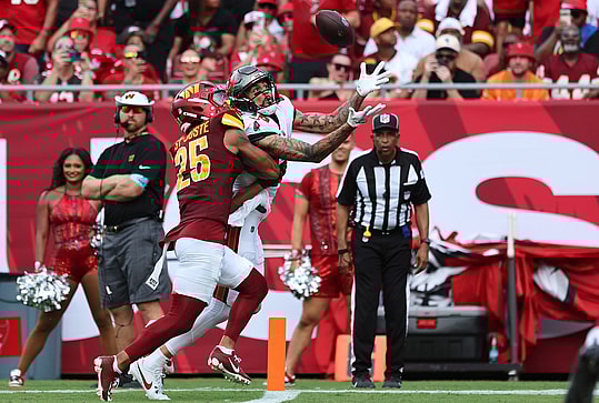 Sep 8, 2024; Tampa, Florida, USA;  Tampa Bay Buccaneers wide receiver Mike Evans (13) catches the ball for a touchdown over Washington Commanders cornerback Benjamin St-Juste (25) during the first half at Raymond James Stadium. Mandatory Credit: Kim Klement Neitzel-Imagn Images