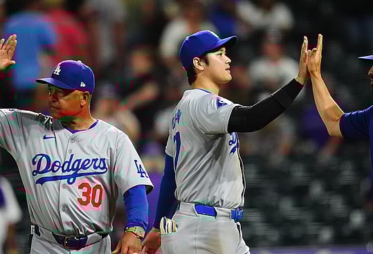 Sep 28, 2024; Denver, Colorado, USA;  Los Angeles Dodgers manager Dave Roberts (30) and designated hitter Shohei Ohtani (17) celebrate defeating the Colorado Rockies at Coors Field. Mandatory Credit: Ron Chenoy-Imagn Images