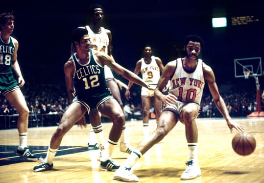 March 6, 1971; New York, NY, USA; FILE PHOTO; New York Knicks guard Walt Frazier (10) is defended by Boston Celtics guard Don Chaney (12) at Madison Square Garden. Mandatory Credit: Manny Rubio-USA TODAY Sports