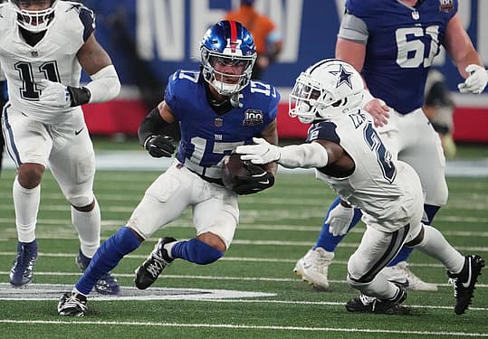 Sep 26, 2024; East Rutherford, New Jersey, USA; New York Giants wide receiver Wan'Dale Robinson (17) runs past Dallas Cowboys cornerback Jourdan Lewis (2) during the second half at MetLife Stadium. Mandatory Credit: Robert Deutsch-Imagn Images