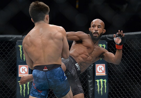August 4, 2018; Los Angeles, CA, USA; Demetrious Johnson moves in against Henry Cejudo during UFC 227 at Staples Center. Mandatory Credit: Gary A. Vasquez-Imagn Images