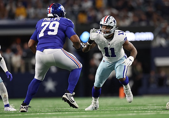 Dallas Cowboys linebacker Micah Parsons (11) rushes against New York Giants offensive tackle Tyre Phillips (79) during the game