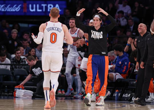 Jan 15, 2024; New York, New York, USA; New York Knicks guard Ryan Arcidiacono (right) celebrates after a basket by guard Donte DiVincenzo (0) during the second half against the Orlando Magic at Madison Square Garden. Mandatory Credit: Vincent Carchietta-Imagn Images