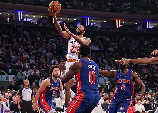 Dec 7, 2024; New York, New York, USA; New York Knicks forward Mikal Bridges (25) drives to the basket in front of Detroit Pistons forward Tim Hardaway Jr. (8) and center Jalen Duren (0) and guard Cade Cunningham (2) during the second half at Madison Square Garden. Mandatory Credit: Vincent Carchietta-Imagn Images