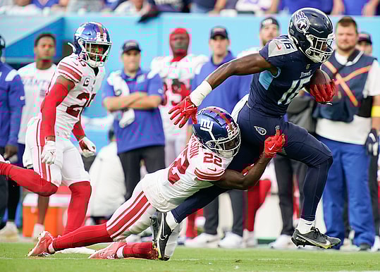 Sep 11, 2022; Nashville, Tennessee, USA; Tennessee Titans wide receiver Treylon Burks (16) picks up a first down as New York Giants cornerback Adoree' Jackson (22) tries to tackle him during the third quarter at Nissan Stadium. Mandatory Credit: George Walker IV-USA TODAY Sports