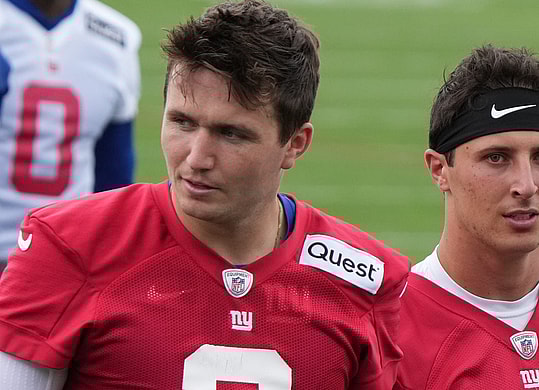 East Rutherford, NJ -- June 11, 2024 -- Quarterbacks,Drew Lock and Tommy DeVito walk off at the end of practice field at the NY Giants Mandatory Minicamp at their practice facility in East Rutherford, NJ.