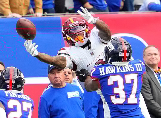 Washington Commanders wide receiver Dyami Brown (2) is unable the catch the ball as New York Giants cornerback Tre Hawkins III (37) defends in the second half at MetLife Stadium