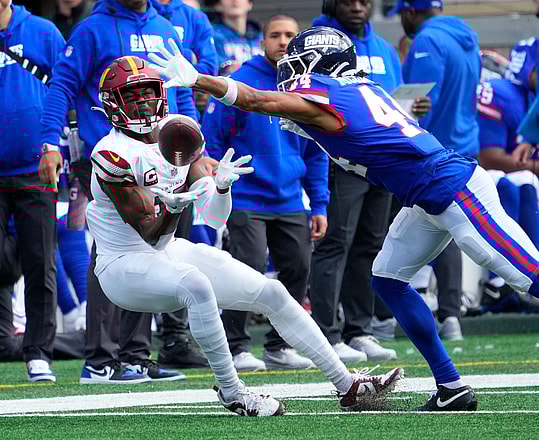 Oct 22, 2023; East Rutherford, New Jersey, USA; Washington Commanders wide receiver Terry McLaurin (17) unable hang on to a first half pass as New York Giants cornerback Nick McCloud (44) defends at MetLife Stadium. Mandatory Credit: Robert Deutsch-USA TODAY Sports