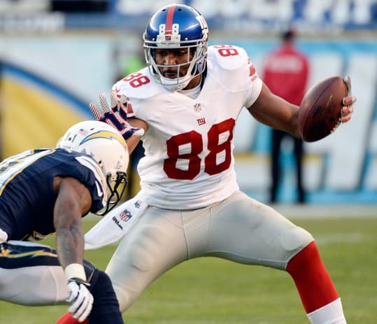Dec 8, 2013; San Diego, CA, USA; New York Giants wide receiver Hakeem Nicks (88) tries to stiff arm San Diego Chargers cornerback Richard Marshall (31) during second half action at Qualcomm Stadium. Mandatory Credit: Robert Hanashiro-USA TODAY Sports