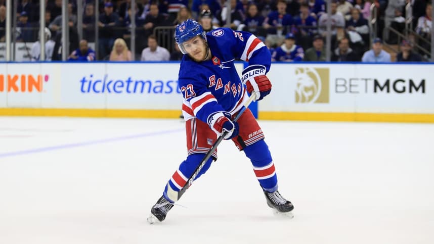 New York Rangers defenseman Adam Fox (23) passes the puck against the Tampa Bay Lightning in the first period of game one of the Eastern Conference Final of the 2022 Stanley Cup Playoffs at Madison Square Garden