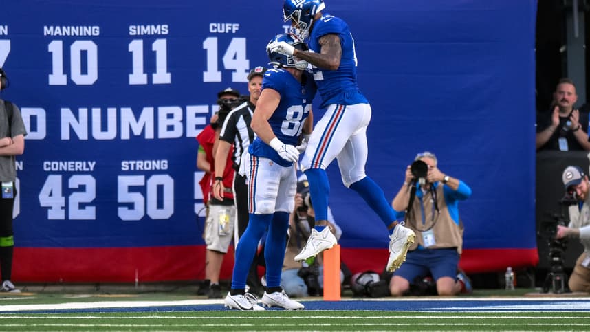 New York Giants tight end Daniel Bellinger (82) celebrates with New York Giants tight end Darren Waller (12) after catching a touchdown pass against the Carolina Panthers during the first quarter at MetLife Stadium