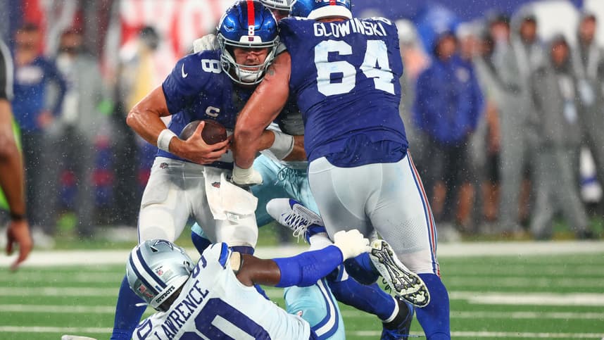 New York Giants quarterback Daniel Jones (8) is sacked by Dallas Cowboys defensive end DeMarcus Lawrence (90) during the second half at MetLife Stadium, Mark Glowinski