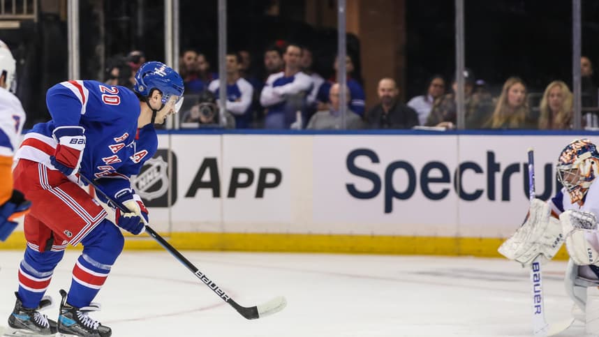 New York Rangers left wing Chris Kreider (20) attempts a shot on goal in the first period against the New York Islanders at Madison Square Garden