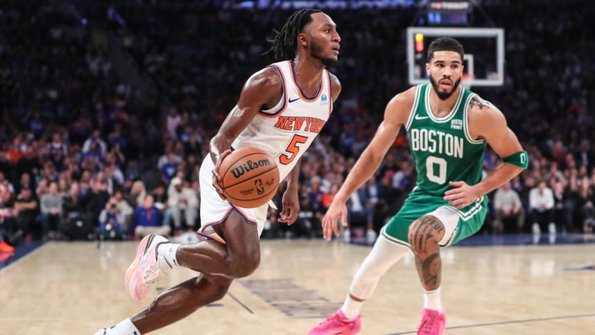 New York Knicks guard Immanuel Quickley (5) looks to drive past Boston Celtics forward Jayson Tatum (0) in the fourth quarter at Madison Square Garden