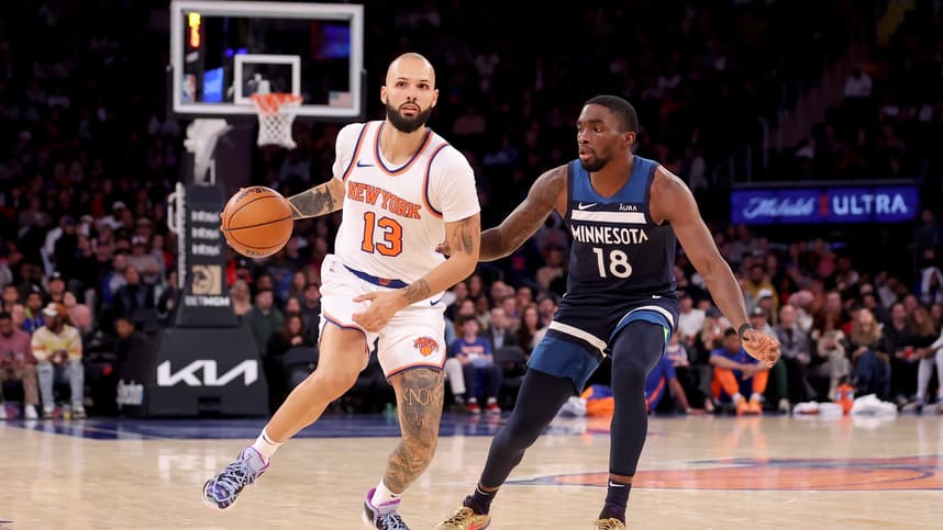 New York Knicks guard Evan Fournier (13) brings the ball up court against Minnesota Timberwolves guard Shake Milton (18) during the fourth quarter at Madison Square Garden