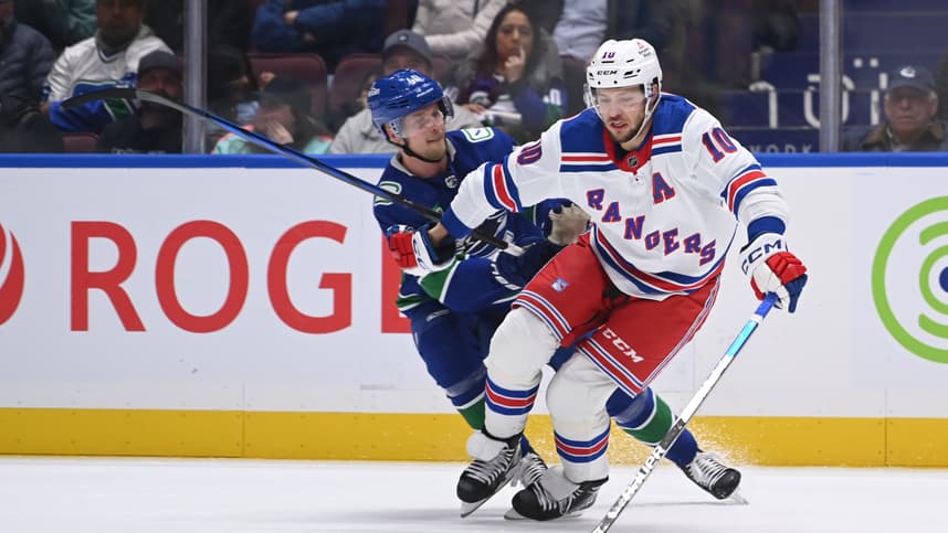Vancouver Canucks center Elias Pettersson (40) checks New York Rangers left wing Artemi Panarin (10) during third  period at Rogers Arena