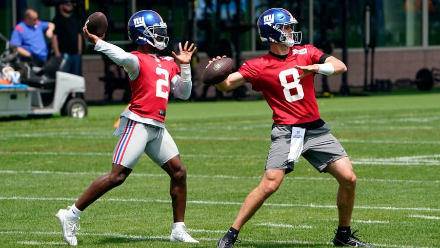 New York Giants quarterbacks Daniel Jones (8) and Tyrod Taylor (2) throw the ball on the first day of mandatory minicamp at the Giants training center in East Rutherford