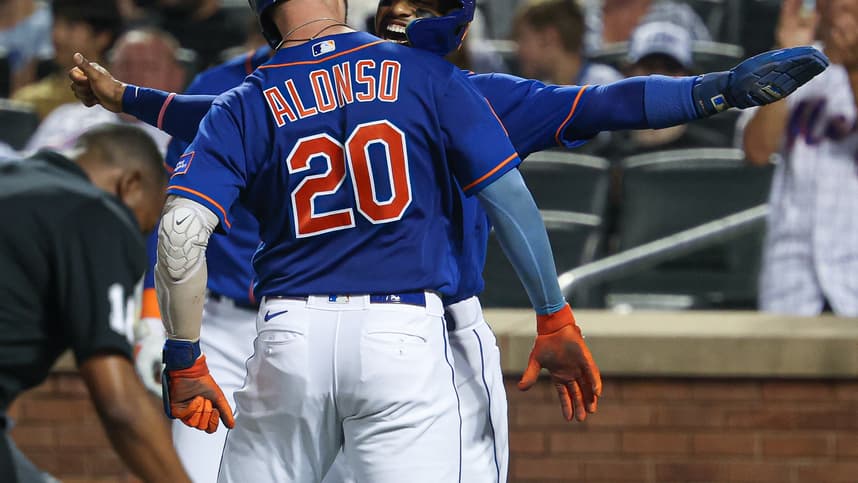 New York Mets first baseman Pete Alonso (20) celebrates with shortstop Francisco Lindor (12) after hitting a two-run home run during the third inning against the Chicago Cubs at Citi Field