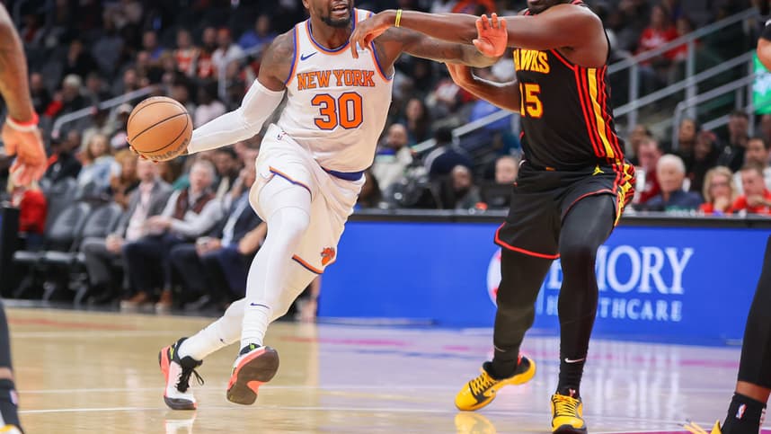 New York Knicks forward Julius Randle (30) drives past Atlanta Hawks center Clint Capela (15) in the first quarter at State Farm Arena