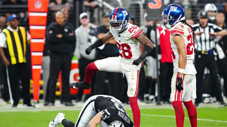 New York Giants cornerback Cor'Dale Flott (28) celebrates after breaking up a reception attempt by Las Vegas Raiders wide receiver Hunter Renfrow (13) during the fourth quarter at Allegiant Stadium
