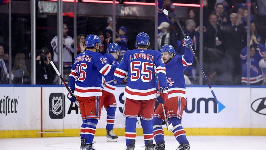 New York Rangers center Vincent Trocheck (16) celebrates his goal against the Minnesota Wild with defenseman Ryan Lindgren (55) and left wing Artemi Panarin (10) during the first period at Madison Square Garden