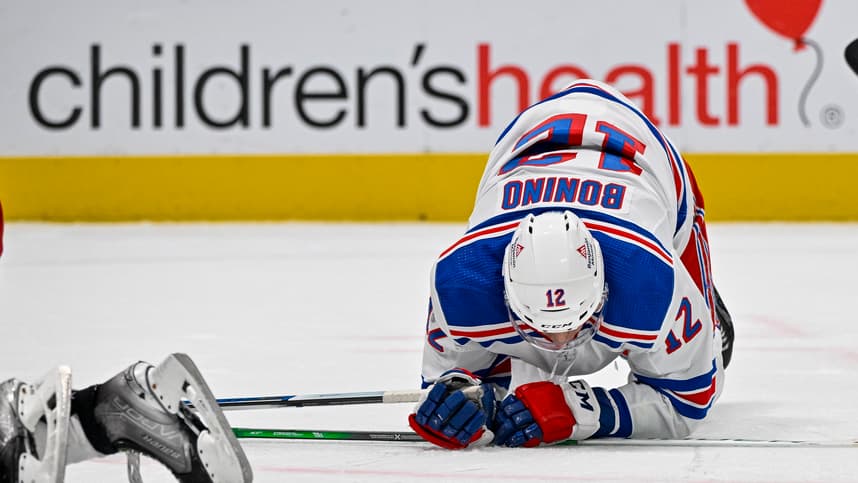 New York Rangers center Nick Bonino (12) falls to the ice during the third period against the Dallas Stars at the American Airlines Center
