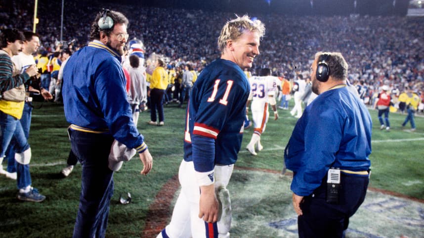 New York Giants quarterback Phil Simms (11) celebrates after defeating the Denver Broncos in Super Bowl XXI at the Rose Bowl. The Giants defeated the Broncos 39-20