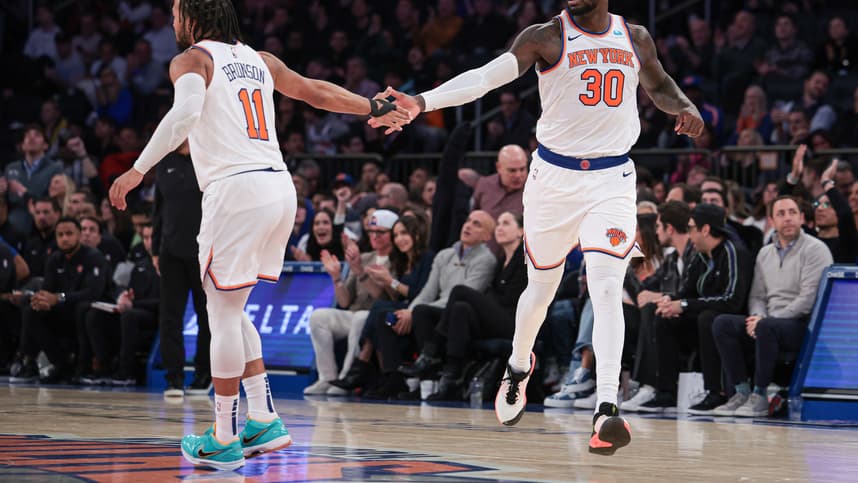New York Knicks forward Julius Randle (30) slaps hands with guard Jalen Brunson (11) after a basket during the second half against the Detroit Pistons at Madison Square Garden