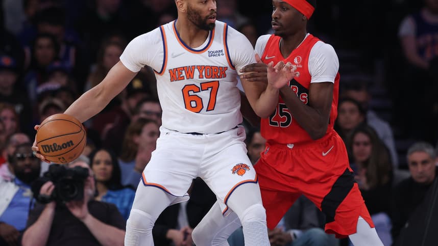 New York Knicks center Taj Gibson (67) dribbles against Toronto Raptors forward Chris Boucher (25) during the first half at Madison Square Garden