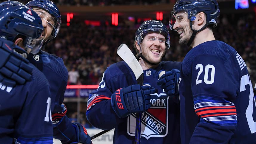 New York Rangers defenseman Adam Fox (23) and New York Rangers left wing Chris Kreider (20) celebrate the goal by New York Rangers left wing Artemi Panarin (10) against the Buffalo Sabres during the first period at Madison Square Garden