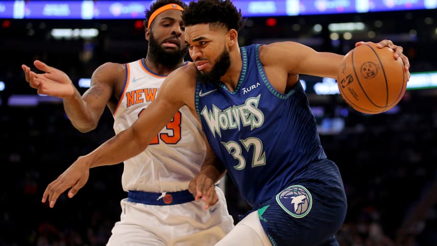Minnesota Timberwolves center Karl-Anthony Towns (32) drives to the basket against New York Knicks center Mitchell Robinson (23) during the first quarter at Madison Square Garden
