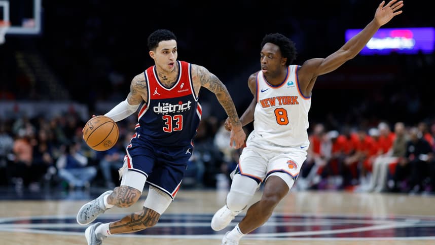 Washington Wizards forward Kyle Kuzma (33) drives to the basket as New York Knicks forward OG Anunoby (8) defends in the third quarter at Capital One Arena