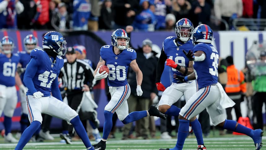New York Giants wide receiver Gunner Olszewski (80) runs back a punt for a touchdown against the Los Angeles Rams during the fourth quarter at MetLife Stadium