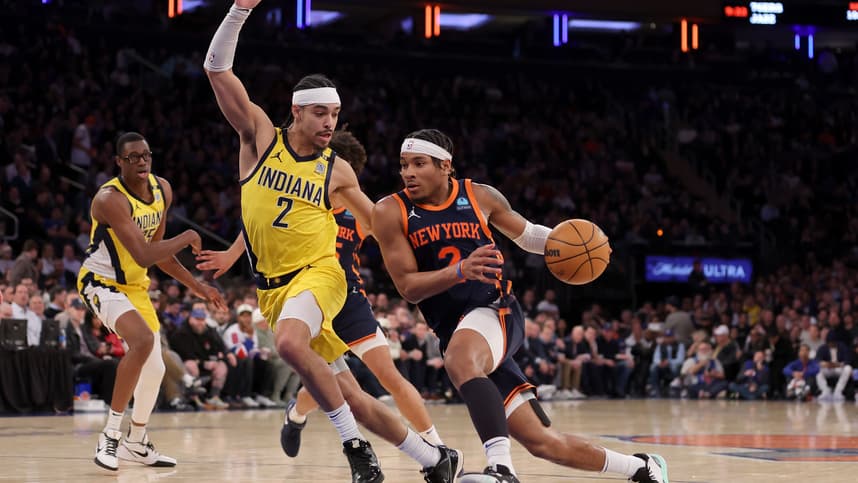 New York Knicks guard Miles McBride (2) drives to the basket against Indiana Pacers guard Andrew Nembhard (2) during the fourth quarter at Madison Square Garden