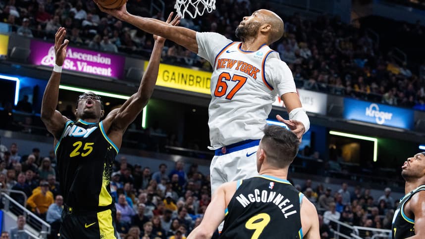 New York Knicks forward Taj Gibson (67) rebounds the ball while Indiana Pacers forward Jalen Smith (25) defends in the second half at Gainbridge Fieldhouse