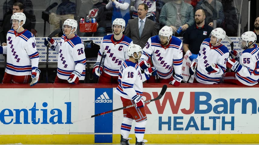 New York Rangers center Vincent Trocheck (16) celebrates with teammates after scoring a goal against the New Jersey Devils during the third period at Prudential Center