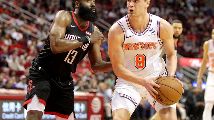 New York Knicks forward Mario Hezonja (8) handles the ball while Houston Rockets guard James Harden (13) defends during the third quarter at Toyota Center