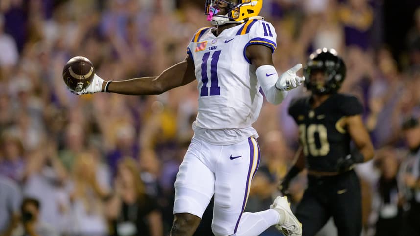 Oct 21, 2023; Baton Rouge, Louisiana, USA; LSU Tigers wide receiver Brian Thomas Jr. (11) (New York Giants draft prospect) celebrates after scoring a touchdown against Army Black Knights defensive back Cameron Jones (10) during the first quarter at Tiger Stadium. Mandatory Credit: Matthew Hinton-USA TODAY Sports