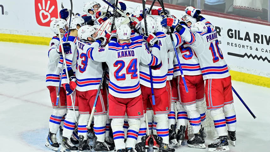 The New York Rangers celebrate after beating the Arizona Coyotes at Mullett Arena