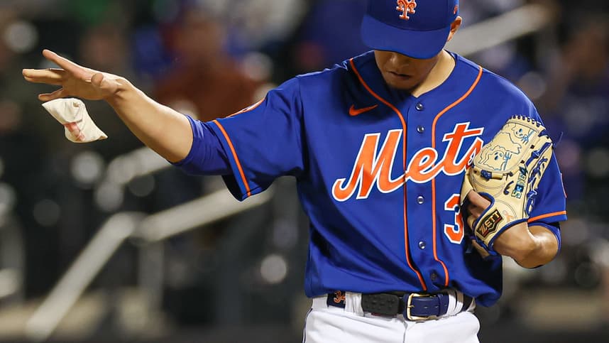 Sep 27, 2023; New York, NY, USA; New York Mets starting pitcher Kodai Senga (34) drops a rosin bag during the fifth inning against the Miami Marlins at Citi Field.  Mandatory Credit: Vincent Carchietta-USA TODAY Sports