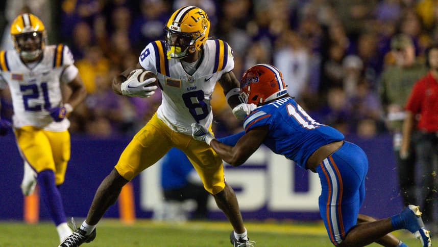 Nov 11, 2023; Baton Rouge, Louisiana, USA;  Florida Gators defensive end Kelby Collins (11) attempts to tackle LSU Tigers wide receiver Malik Nabers (8) during the second half at Tiger Stadium. Mandatory Credit: Stephen Lew-USA TODAY Sports