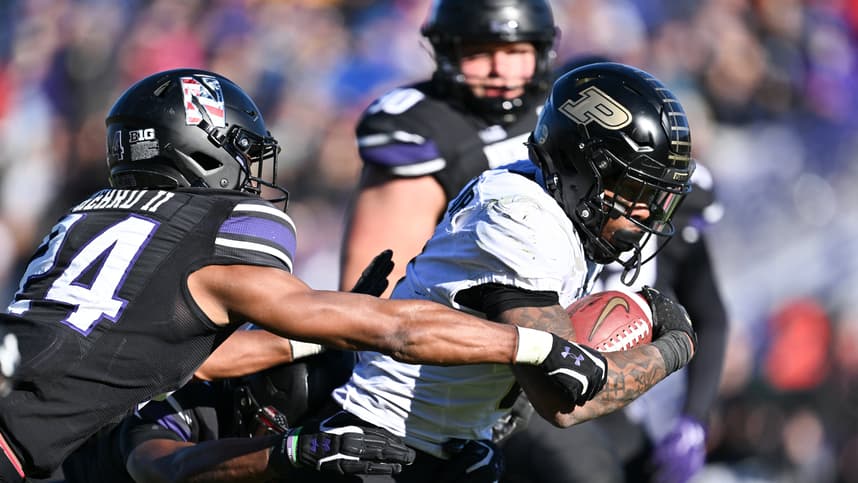 Nov 18, 2023; Evanston, Illinois, USA; Purdue Boilermakers running back Tyrone Tracy Jr. (3)(New York Giants) breaks a tackle by Northwestern Wildcats defensive back Rod Heard II (24) for a touchdown run in the third quarter at Ryan Field. Mandatory Credit: Jamie Sabau-USA TODAY Sports