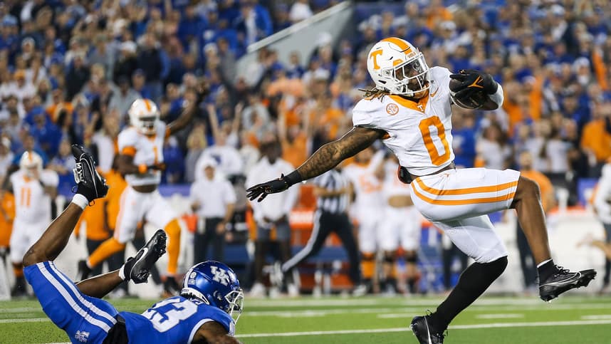 Tennessee Volunteers running back Jaylen Wright (New York Giants prospect) (0) dodges Kentucky Wildcats defensive back Andru Phillips (23) to strike first with a Volunteer touchdown early in the first quarter Saturday in Lexington. Oct. 28, 2023.