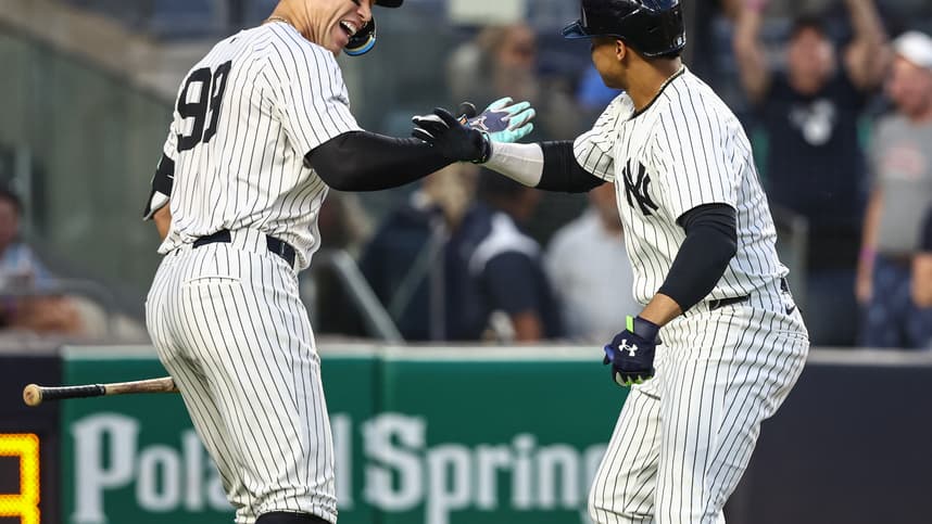 May 22, 2024; Bronx, New York, USA;  New York Yankees right fielder Juan Soto (22) celebrates with center fielder Aaron Judge (99) after hitting a two-run home run in the third inning against the Seattle Mariners at Yankee Stadium. Mandatory Credit: Wendell Cruz-USA TODAY Sports