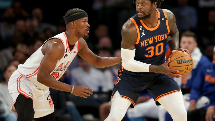Mar 29, 2023; New York, New York, USA; New York Knicks forward Julius Randle (30) controls the ball against Miami Heat forward Jimmy Butler (22) during the first quarter at Madison Square Garden. Mandatory Credit: Brad Penner-USA TODAY Sports