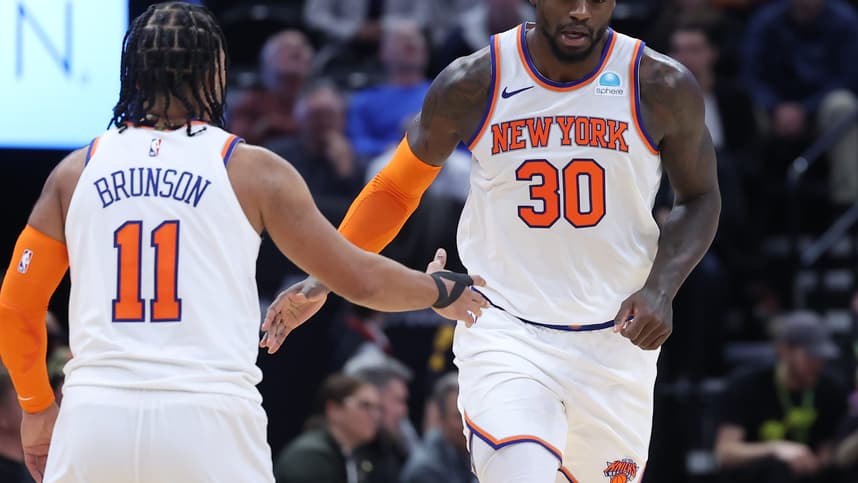 New York Knicks forward Julius Randle (30) and guard Jalen Brunson (11) react to a play against the Utah Jazz during the third quarter at Delta Center