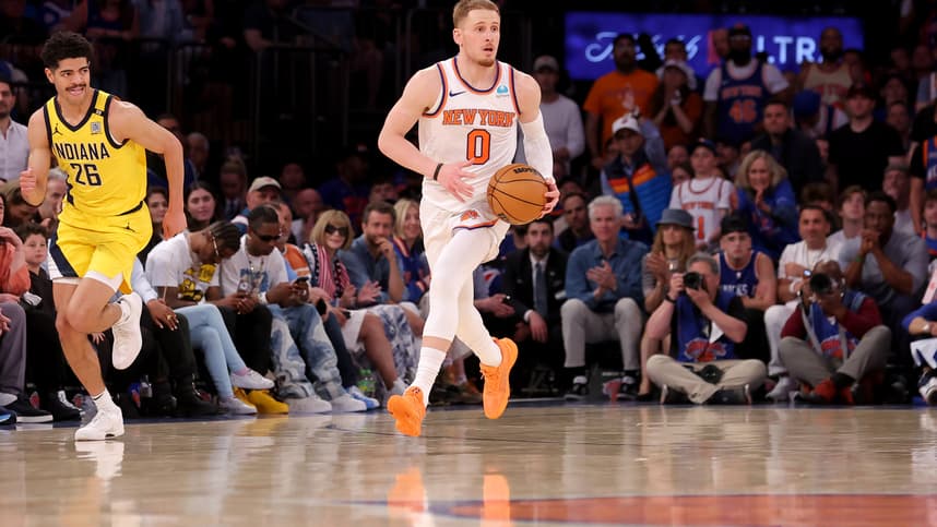 May 19, 2024; New York, New York, USA; New York Knicks guard Donte DiVincenzo (0) brings the ball up court against Indiana Pacers guard Ben Sheppard (26) during the fourth quarter of game seven of the second round of the 2024 NBA playoffs at Madison Square Garden. Mandatory Credit: Brad Penner-USA TODAY Sports